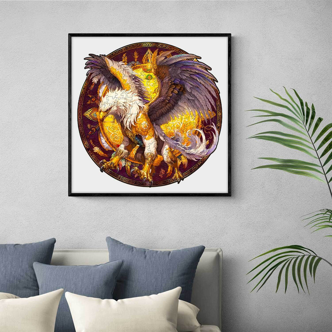 Framed Griffin wooden jigsaw puzzle artwork displayed on a wall above a stylish couch with blue cushions.
