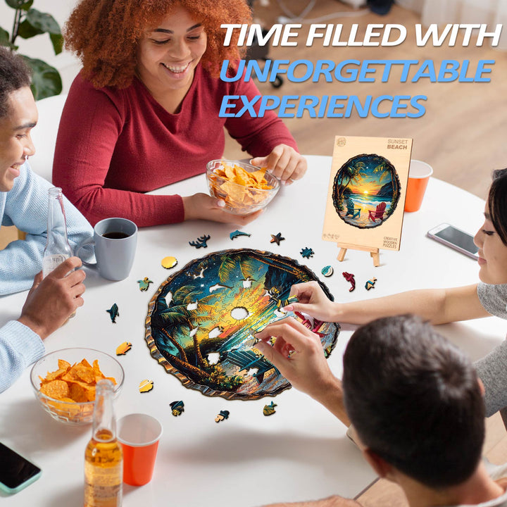 Friends enjoying a 3D Sunset Beach wooden jigsaw puzzle while sharing snacks and drinks around a table.