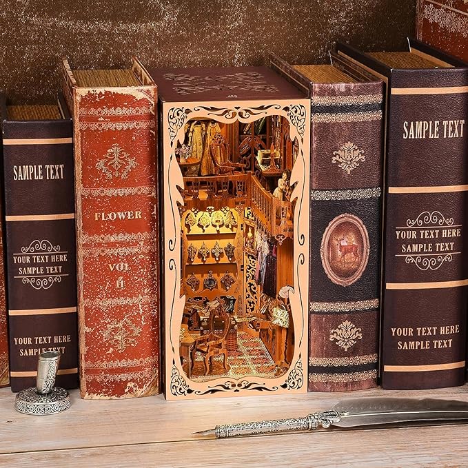 Duchess Wardrobe DIY Book Nook Kit displayed among vintage books, showcasing intricate design and luxury details.