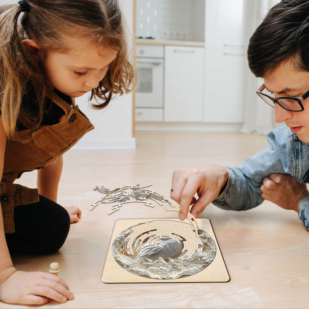 A father and daughter enjoying the Maze Puzzles—Elegant Owl, engaging in focused puzzle-solving playtime.