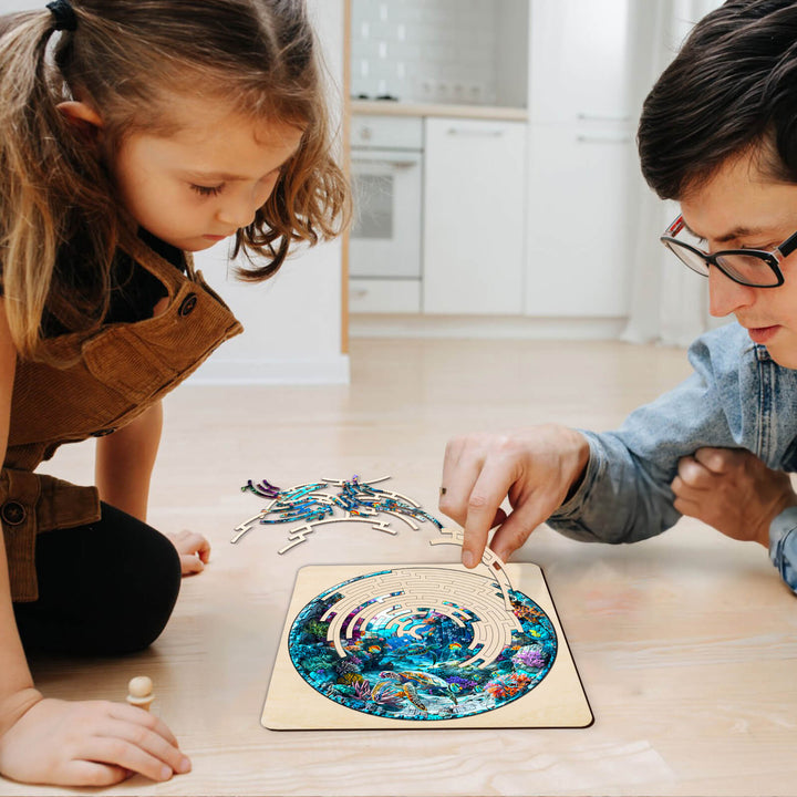 Adult and child enjoying the Maze Puzzles—Blue Ocean, focusing on jigsaw puzzle exploration together.
