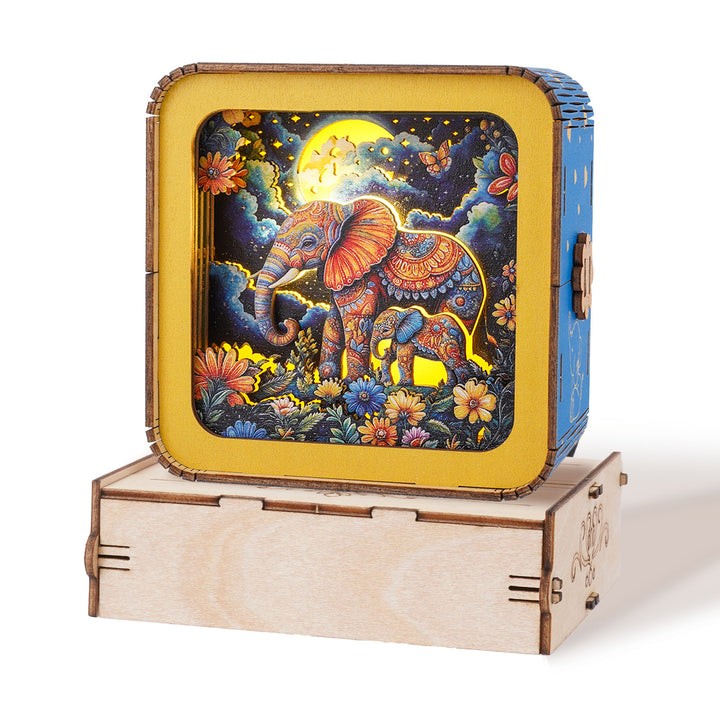 3D wooden puzzle night light featuring an elephant under the moon, colorful floral design, perfect for home decor.