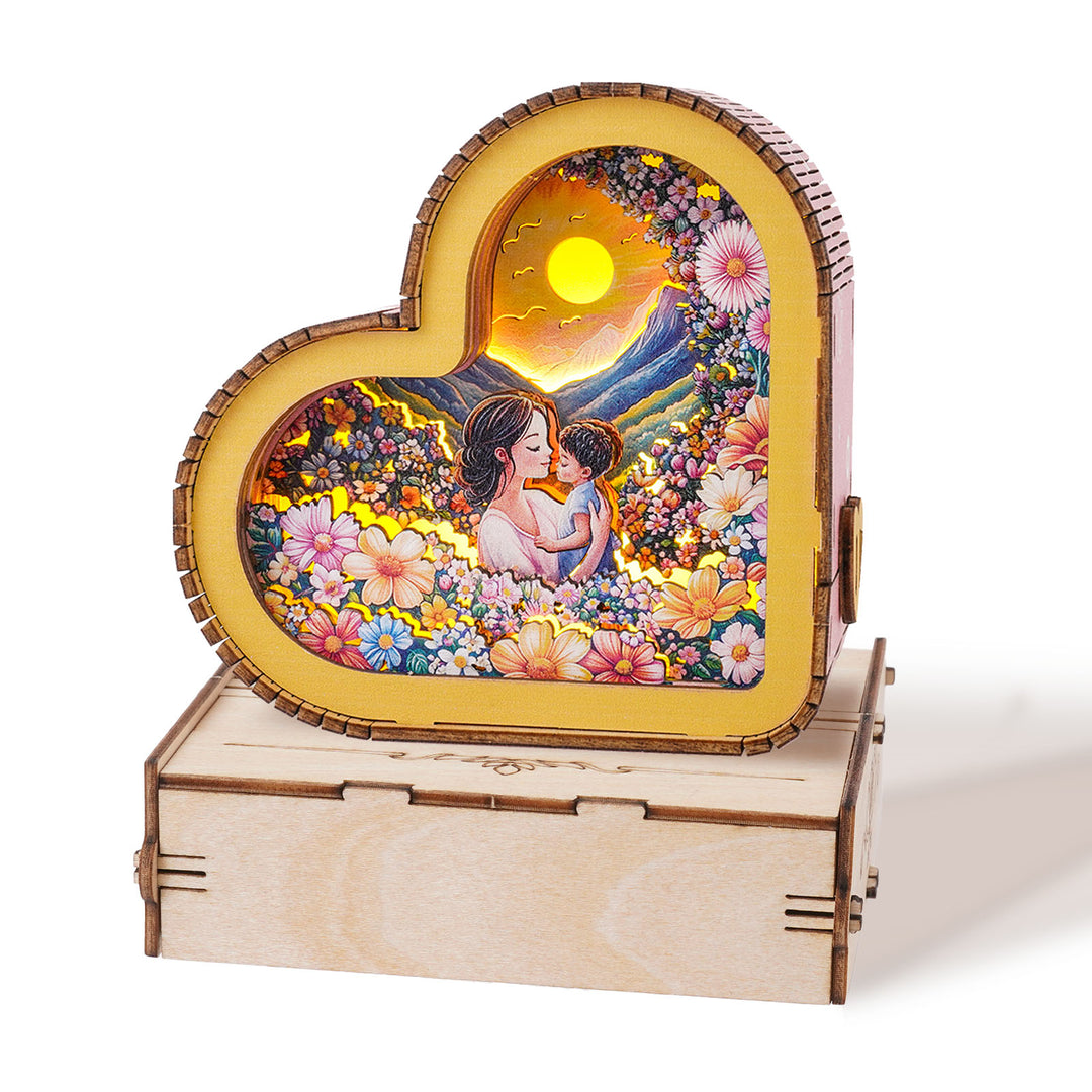 Heart-shaped wooden night light showcasing a mother and child in a floral scene, symbolizing love and warmth.