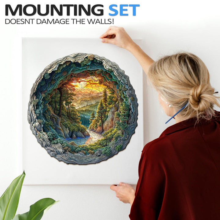 Person mounting a 3D cave forest jigsaw puzzle on the wall, showcasing its vibrant colors and intricate design.