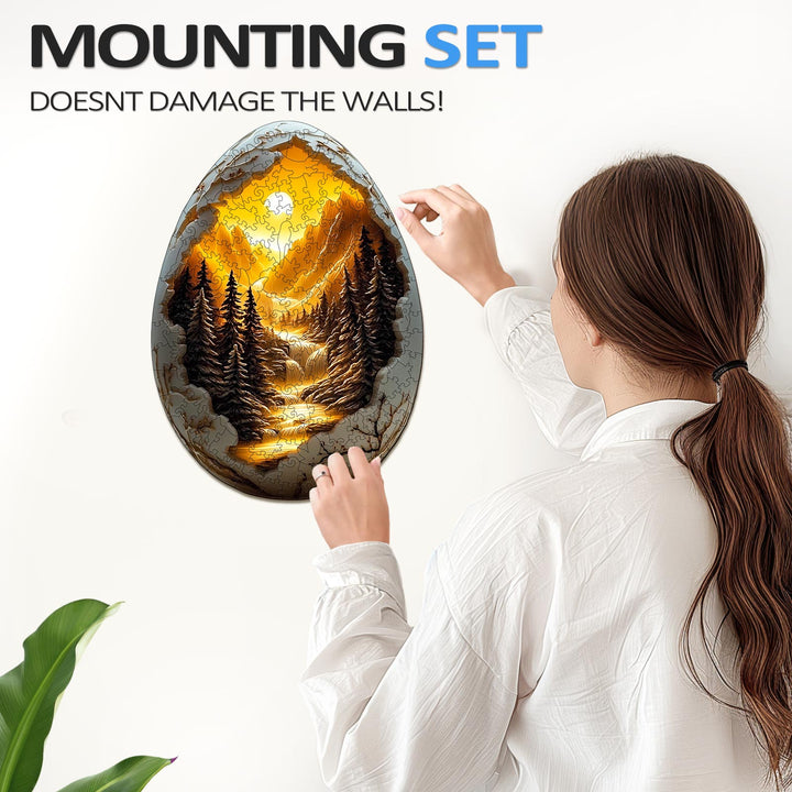 Woman placing 3D Eggshell World-1 wooden puzzle on the wall with a damage-free mounting set.