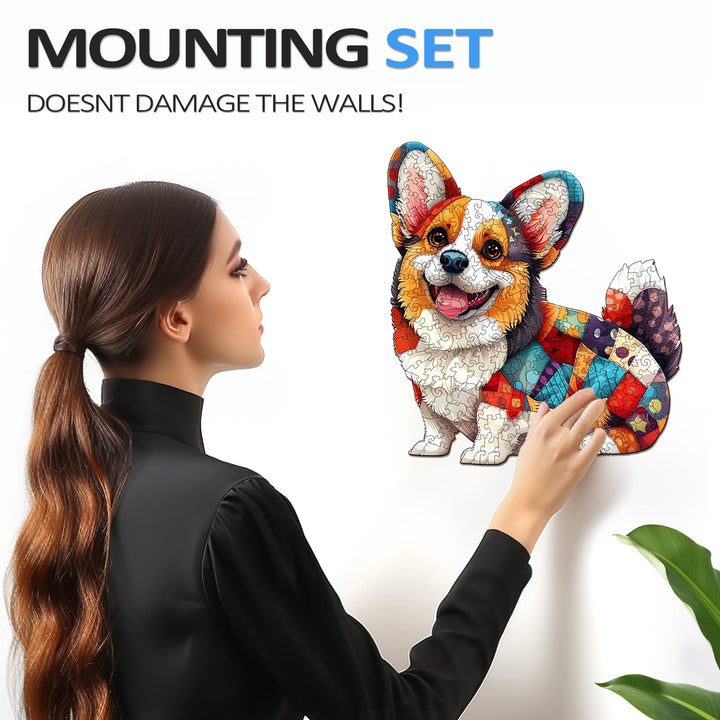 Woman mounting a colorful patchwork corgi puzzle on a wall without causing damage, showcasing the innovative design.