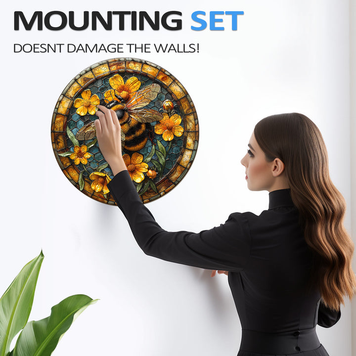 Woman installing a stained glass wall decor with mounting set that doesn't damage the walls.