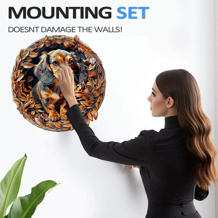 Woman using a wall mounting set to display a wooden dachshund puzzle without damaging the walls.