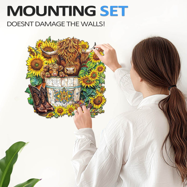 Woman using a mounting set to display a sunflower puzzle on the wall, illustrating easy wall decor.