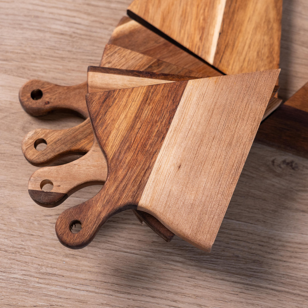 Stylish acacia wood pizza serving trays with unique split design for easy portioning and sharing.