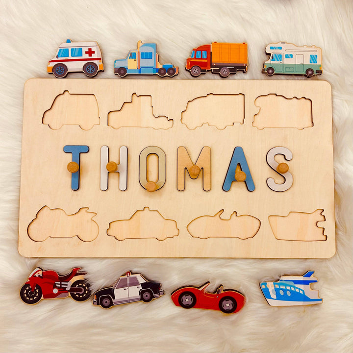 Personalized wooden name puzzle for children named Thomas, featuring colorful transport icons and engaging letters.