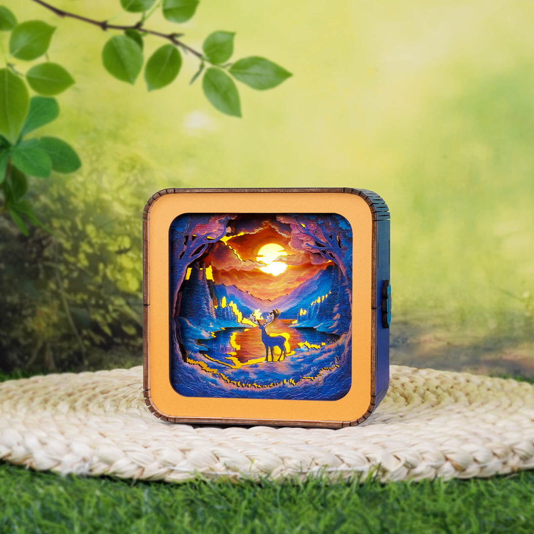 3D wooden puzzle night light featuring a colorful forest scene with a deer and sunset, showcasing nature's beauty.