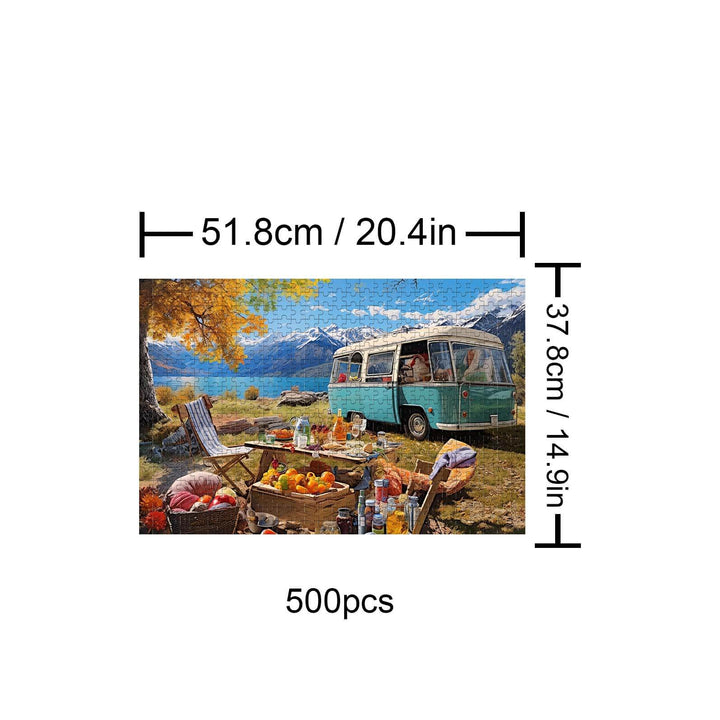 500-piece camping puzzle featuring a scenic outdoor picnic with mountains and a vintage camper.