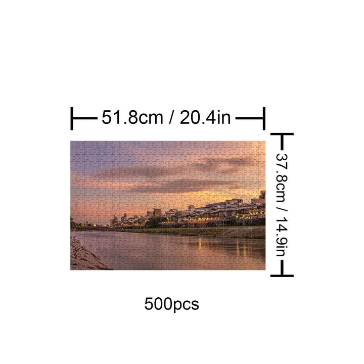 Sunset River City 500 piece jigsaw puzzle featuring a serene river view at dusk, enhancing focus and cognitive skills.