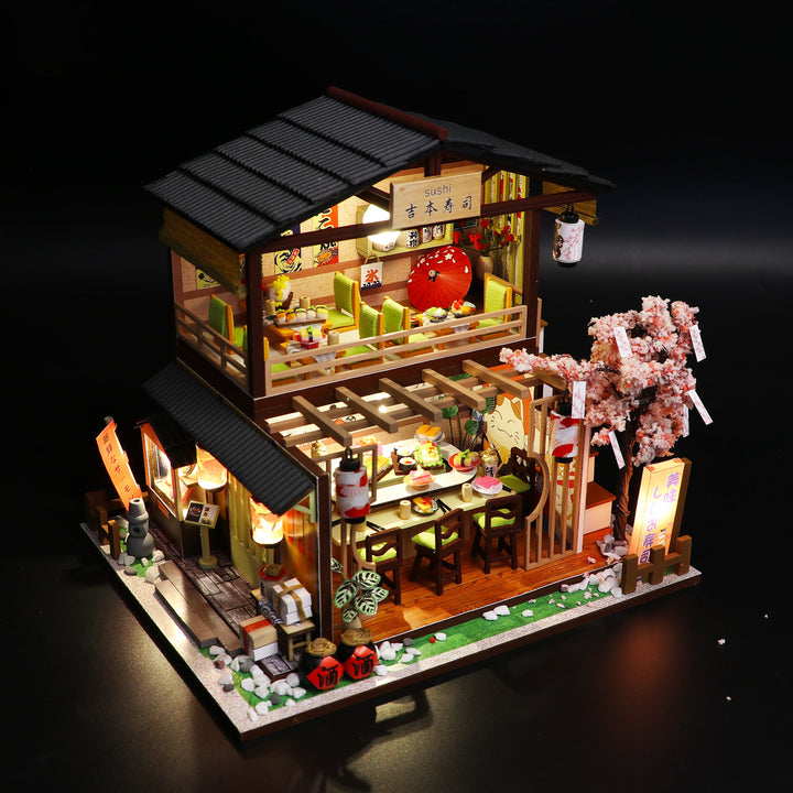 Sakura Sushi House DIY dollhouse kit, 3D wooden puzzle, illuminated interior with cherry blossom details.
