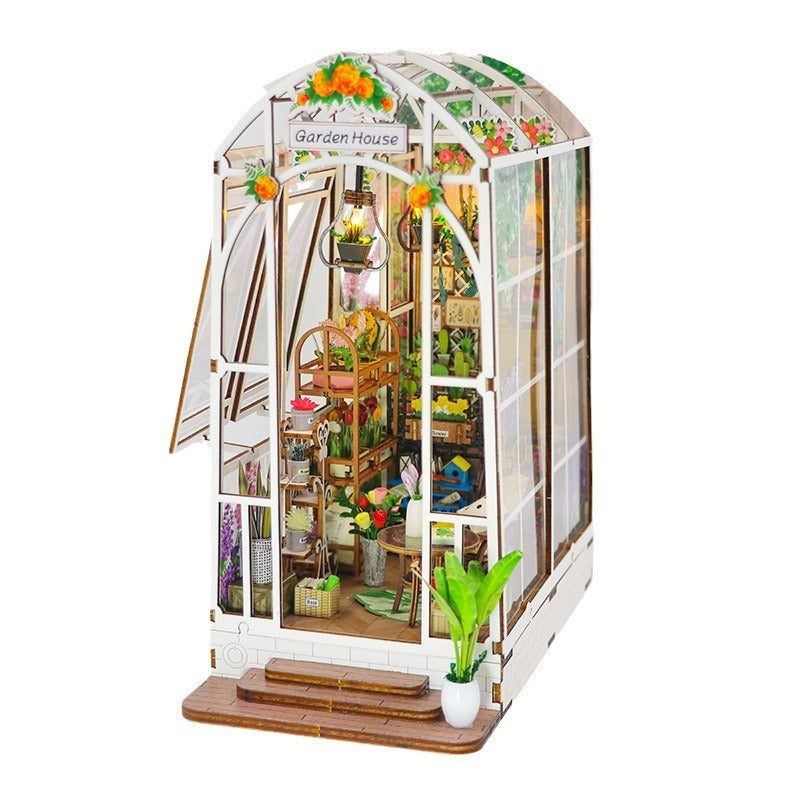 DIY Garden House book nook kit featuring detailed wooden puzzle with plants and musical elements.