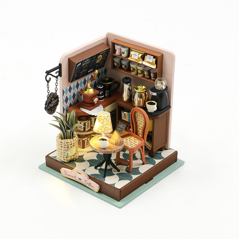 DIY miniature coffee shop dollhouse kit with detailed furnishings and decor, perfect for creative hobbies.