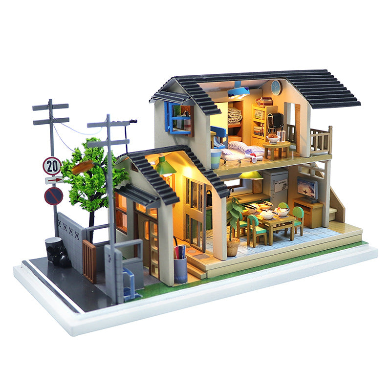 Japanese-style DIY dollhouse kit featuring a detailed 3D wooden puzzle with colorful rooms and miniature furniture.
