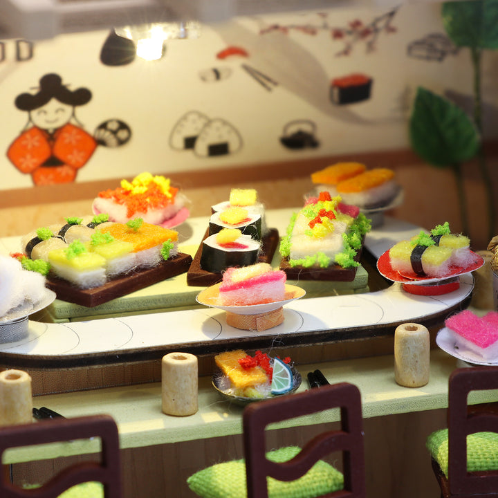 Colorful miniature sushi display in a DIY dollhouse kit, showcasing vibrant delicacies like nigiri and maki.