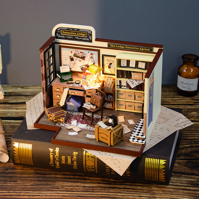 DIY Dollhouse Kit of a detective agency interior, featuring a desk, shelves, and mini decor, perfect for craft lovers.