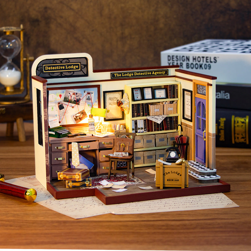 Interior view of the DIY Magic Detective Agency dollhouse kit featuring a cozy, detailed detective lodge workspace.