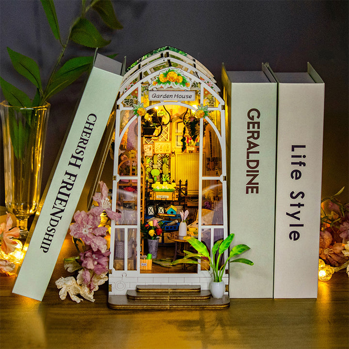 Garden House DIY book nook kit showcasing intricate 3D wooden puzzle design with musical theme and warm lighting.