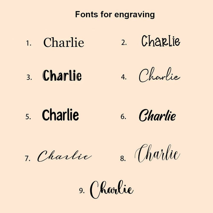 Different font styles for engraving the name Charlie on a personalized piggy bank.