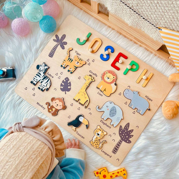 Personalized jungle animal name puzzle featuring colorful letters and cute animal figures for kids' playroom.