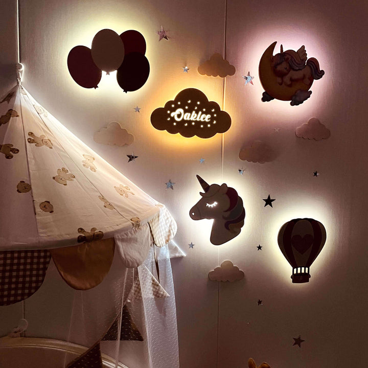 Personalized wooden baby room wall light set featuring balloons, clouds, a unicorn, and hot air balloon for soothing ambiance.