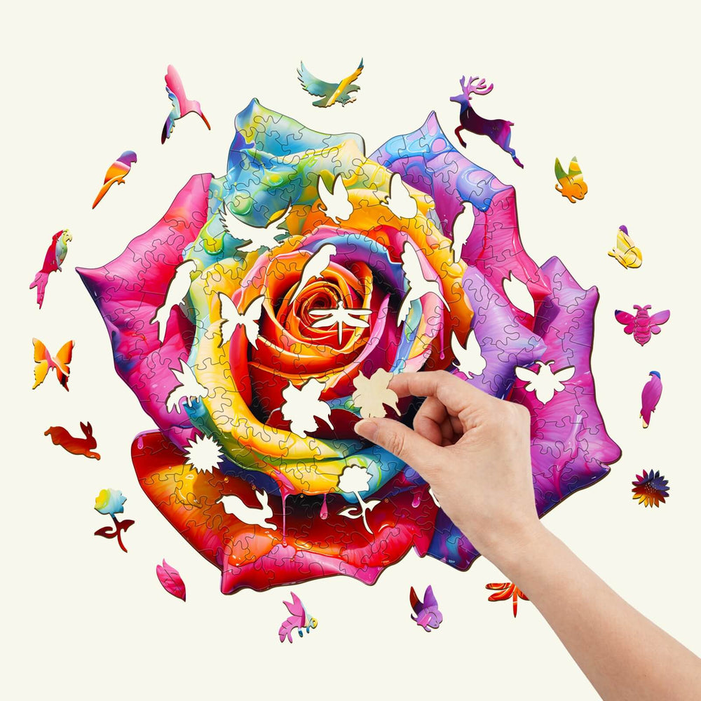 Colorful rose wooden jigsaw puzzle with hand placing a piece, perfect for mind games and enhancing focus.