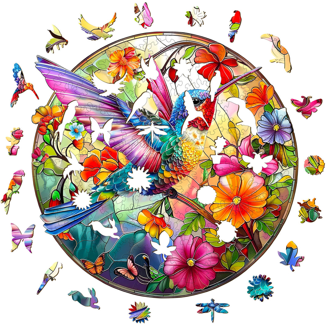 Colorful stained glass hummingbird jigsaw puzzle pieces surrounded by vibrant flowers and butterflies.
