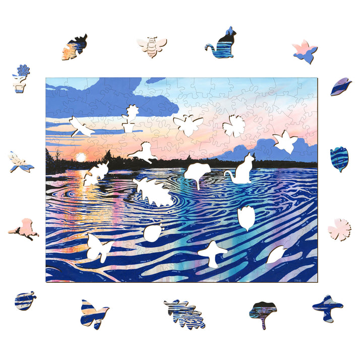 Black Rapids View puzzle by artist Sarah Bradfield, featuring vibrant sunset and unique shapes, perfect for artistic inspiration.