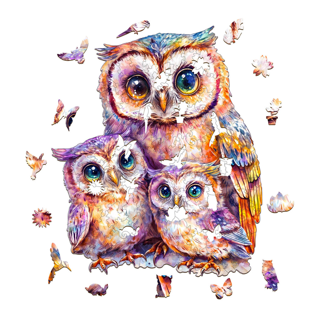 Sweet Owl Family wooden jigsaw puzzle showcasing a mother and two baby owls among scattered puzzle pieces.
