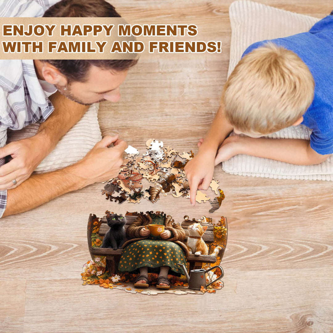 Father and son enjoying quality time together while completing a Grandma's Party wooden jigsaw puzzle on the floor.