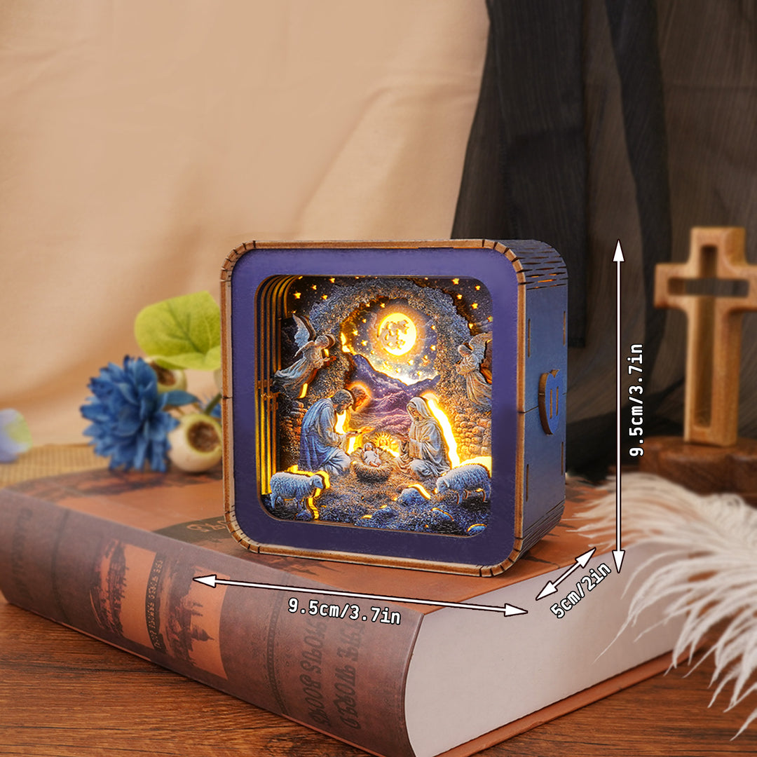 Nativity Kit 3D wooden puzzle night light showcasing a detailed scene, placed on a decorative book.