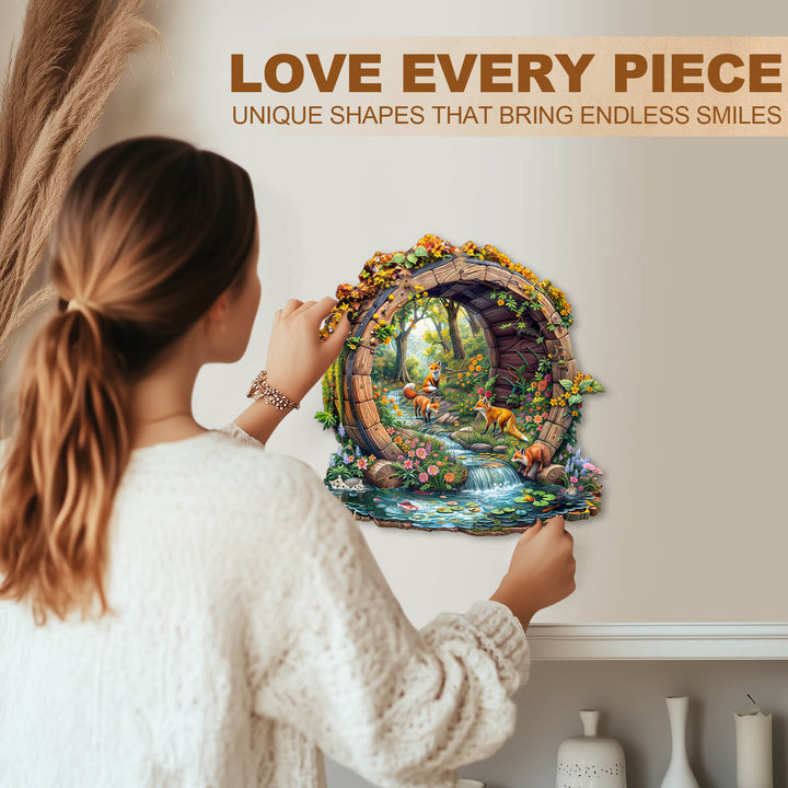 Woman assembling a vibrant wooden jigsaw puzzle featuring happy foxes in a serene, floral scene.