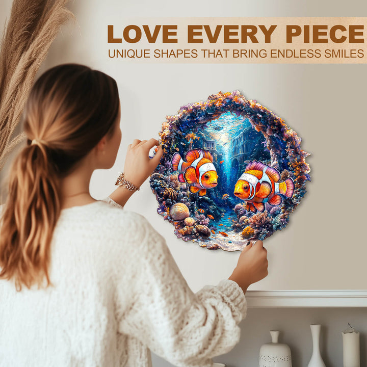 Person assembling Clownfish Journey Wooden Jigsaw Puzzle, showcasing vibrant colors and unique shapes for endless fun.