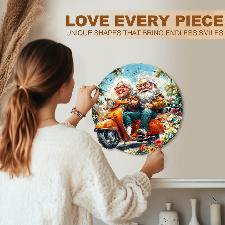 Person placing the Motorcycle Granny-1 wooden jigsaw puzzle on the wall, celebrating unique shapes and fun.