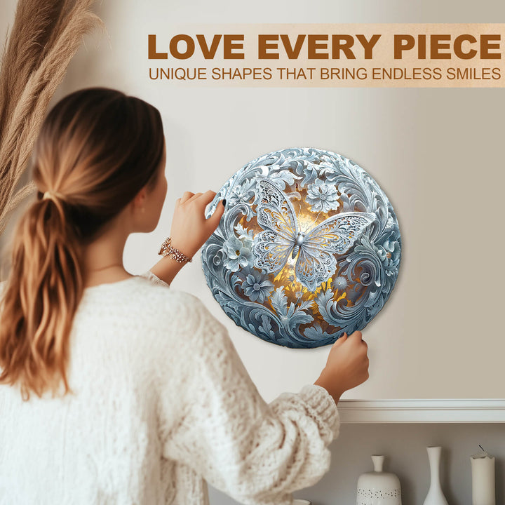 Woman assembling the Celestial Wings wooden jigsaw puzzle with intricate butterfly design, promoting focus and creativity.