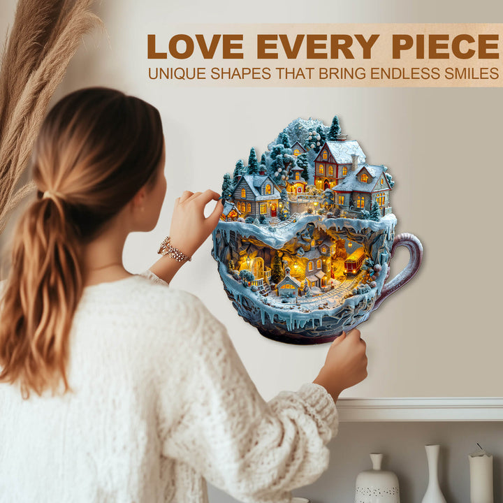 A woman assembling a Train and Village wooden jigsaw puzzle featuring vibrant shapes and cozy winter scenes inside a cup.