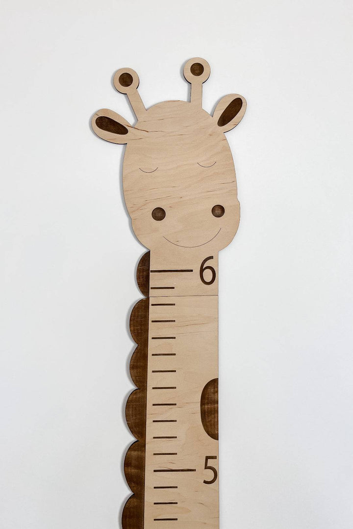 Wooden giraffe growth chart height ruler for kids, measuring up to 6 feet, perfect for children's room decor.