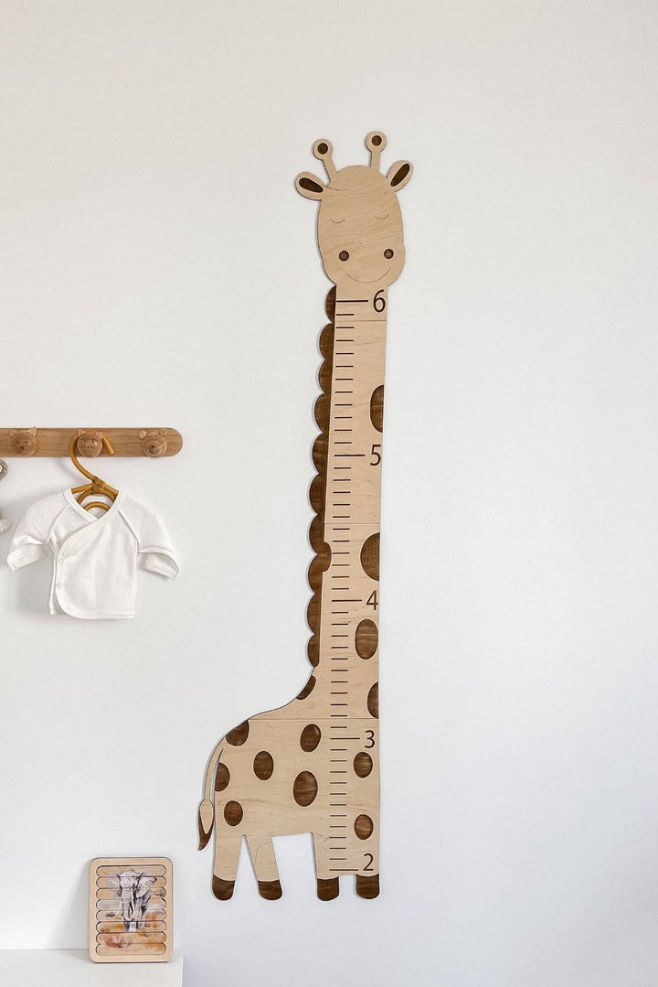 Wooden giraffe growth chart height ruler for kids, perfect for recording child's growth and nursery decor.