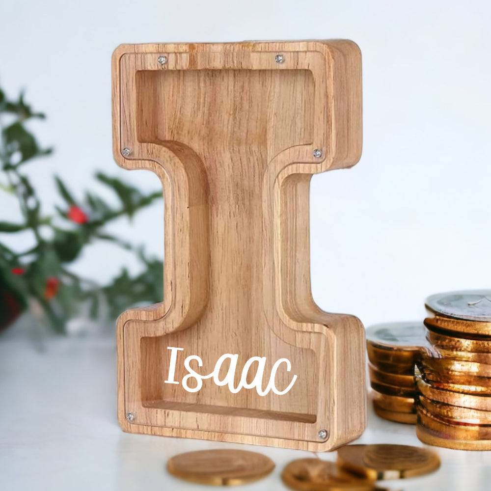Personalized wooden letter piggy bank shaped like 'I' with the name Isaac, perfect for teaching kids about savings.