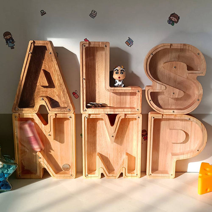 Personalized wooden letter piggy bank featuring large letters for children's financial education and awareness.