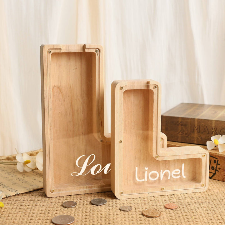 Custom wooden letter piggy bank for kids, personalized savings bank with coin slot, ideal gift for teaching financial literacy.