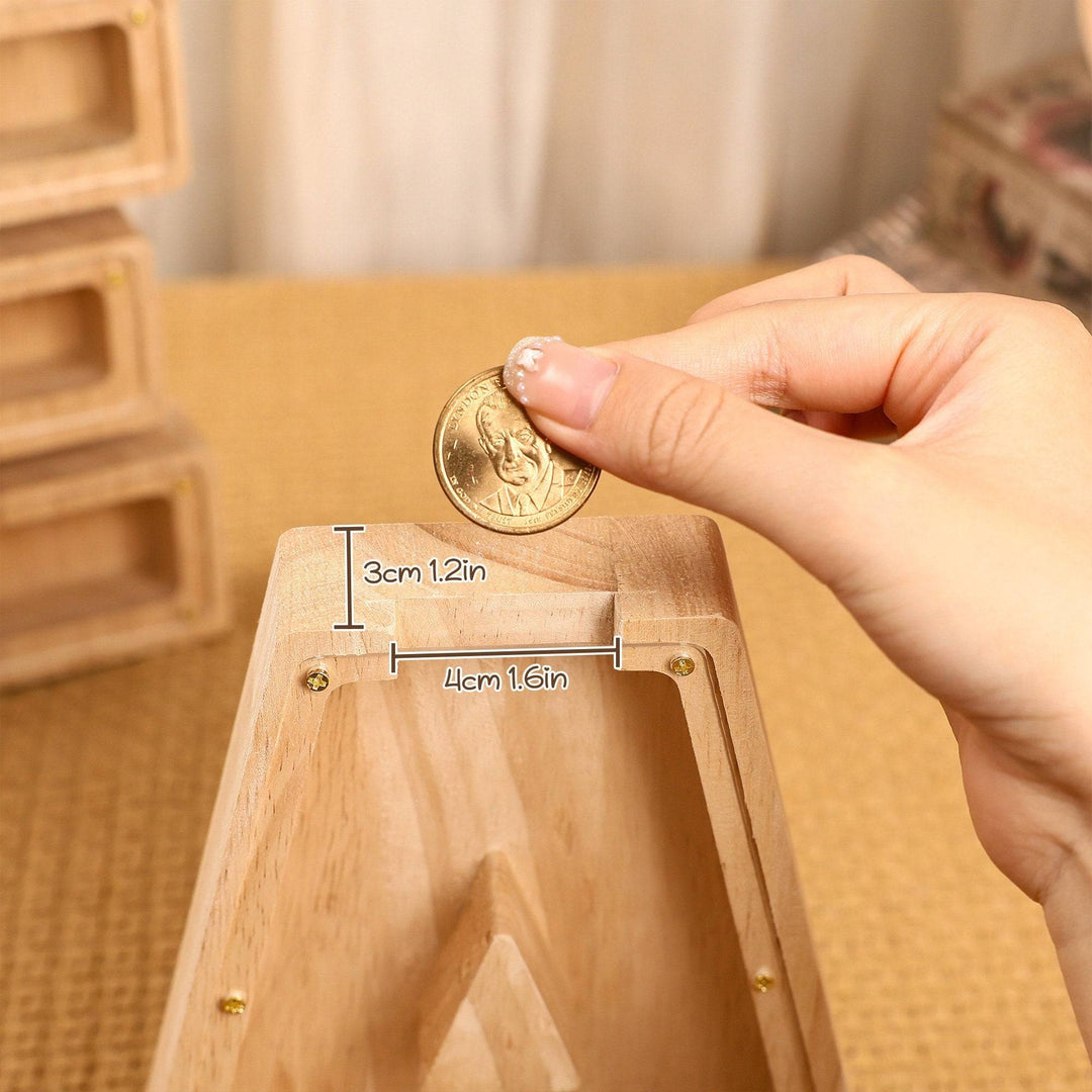 Child's hand inserting a coin into a custom wooden letter piggy bank, highlighting savings education.