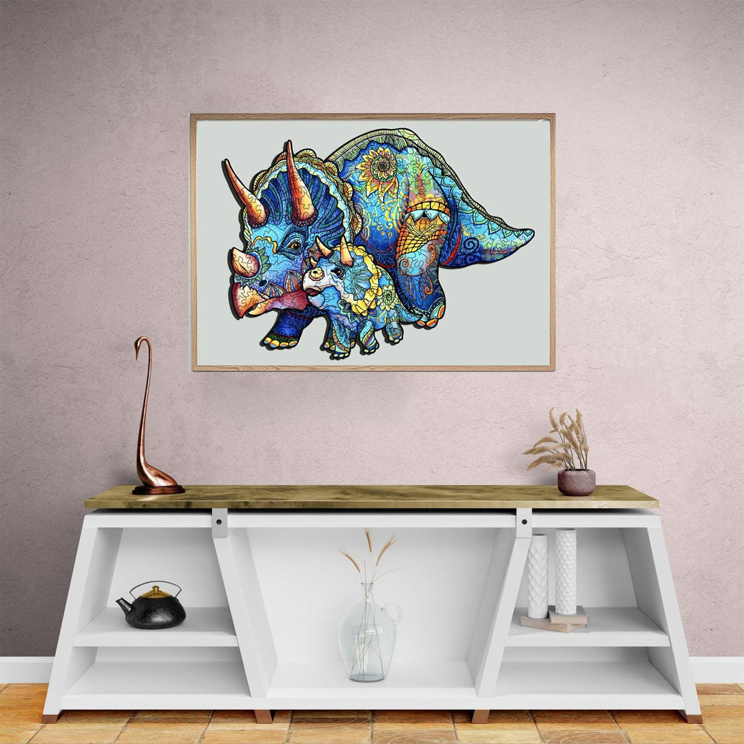 Colorful Triceratops wall art displayed above a modern wooden console table in a stylish interior setting.