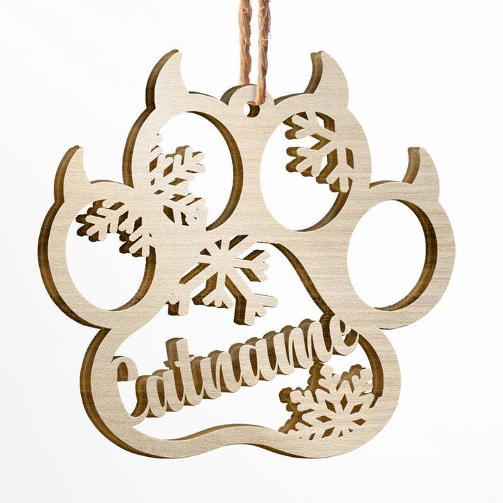 Personalized wooden cat paw ornament with snowflakes, perfect for Christmas crafting and decorating.