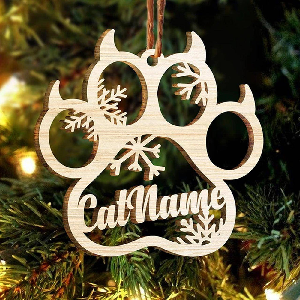 Personalized cat paw wooden ornament with angel wings and snowflakes, perfect for holiday decorating.