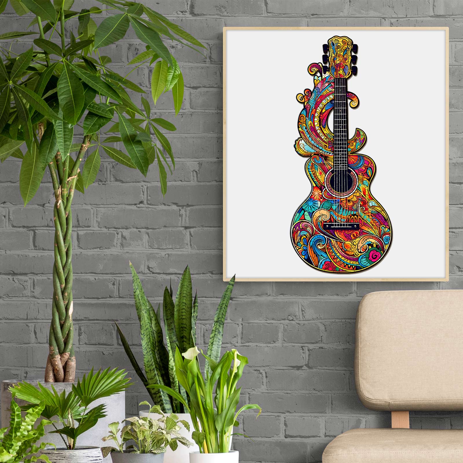 Colorful guitar artwork with vibrant patterns hanging in a modern room with plants and a cozy chair.